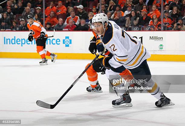 Luke Adam of the Buffalo Sabres skates against the Philadelphia Flyers on November 21, 2013 at the Wells Fargo Center in Philadelphia, Pennsylvania.