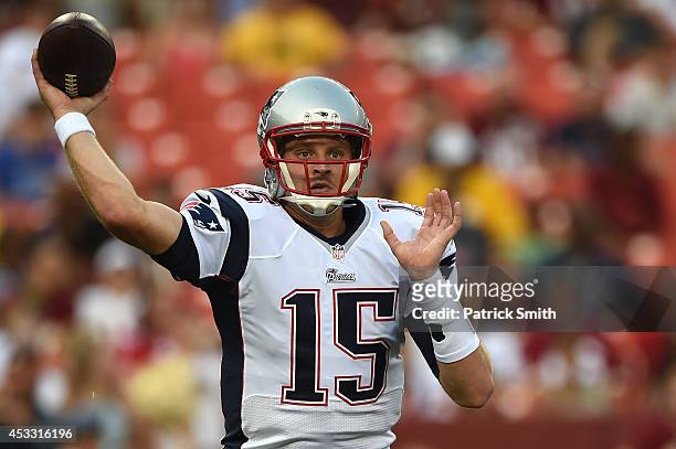 Quarterback Ryan Mallett of the New England Patriots makes a pass in the first quarter against the Washington Redskins during a preseason NFL game at...