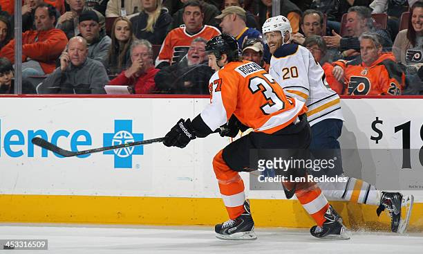 Jay Rosehill of the Philadelphia Flyers battles for the puck against Henrik Tallinder of the Buffalo Sabres on November 21, 2013 at the Wells Fargo...