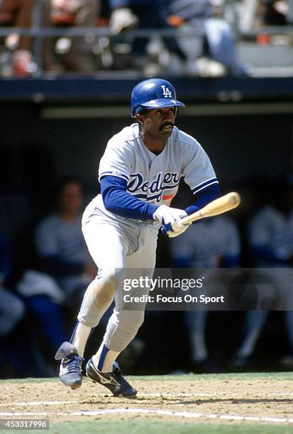 Alfredo Griffin of the Los Angeles Dodgers bats against the San Diego Padres during a Major League Baseball game circa 1991 at Jack Murphy Stadium in...