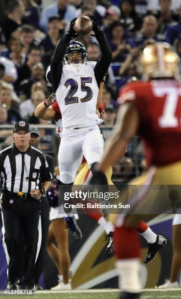 The Baltimore Ravens' Asa Jackson interceptes a deep pass intended for the San Francisco 49ers' Derek Carrier in the second quarter during preseason...