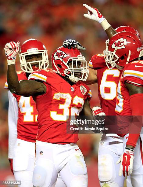 Cyrus Gray of the Kansas City Chiefs celebrates scoring a touchdown with his teammates against the Cincinnati Bengals at Arrowhead Stadium on August...