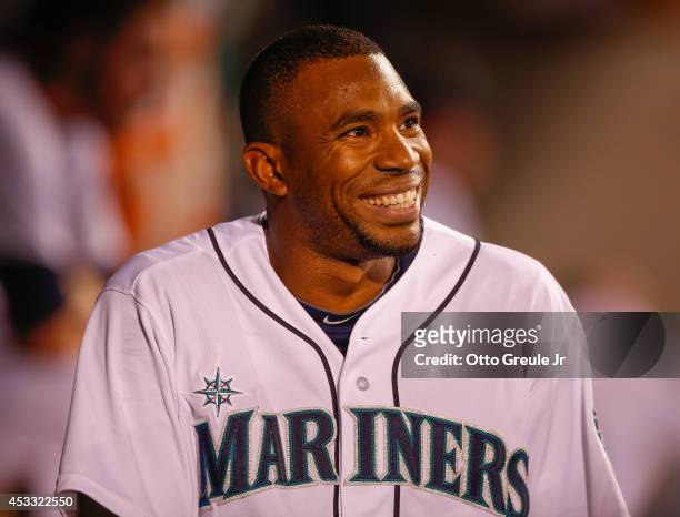 Endy Chavez of the Seattle Mariners smiles in the dugout after laying down a sacrifice bunt in the fifth inning against the Chicago White Sox at...