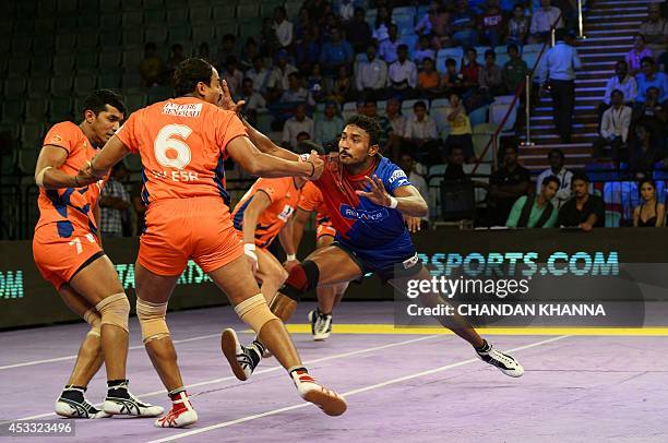 To go with India-Sport-Lifestyle-Kabaddi by Abhaya Srivastava In this photograph taken on August 6 a raider of Delhi Dabang Kashiling Adake attempts...