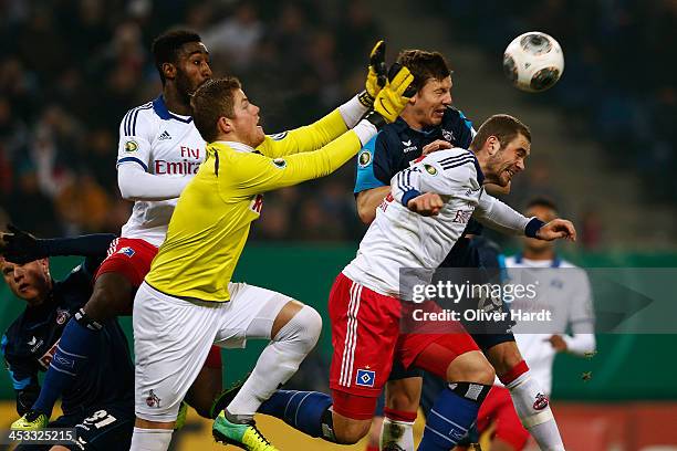 Pierre Michel Lasogga of Hamburg and Timo Horn of Koeln compete for the ball during the DFP Cup round of 16 at Imtech Arena on December 3, 2013 in...