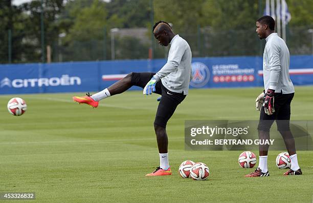 Paris Saint-Germain's French goalkeeper Mory Diaw and Paris Saint-Germain's French goalkeeper Mike Maignan attend a training session on August 7,...