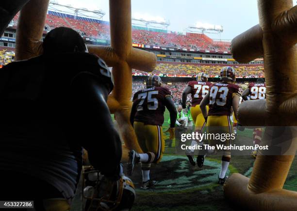 The Washington Redskins take the field for the start of the game between the Washington Redskins and the New England Patriots at FedEx Field on...