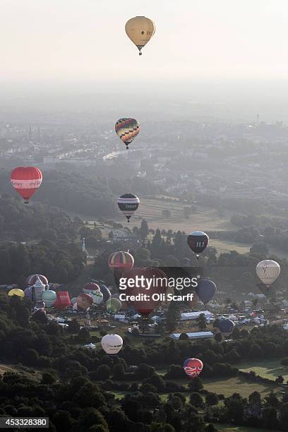 Over 120 hot air balloons depart from Aston Court in a mass ascent on the first full day of the Bristol International Balloon Fiesta on August 8,...