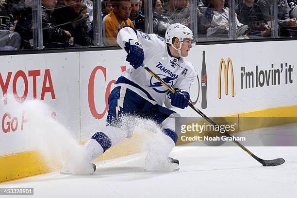 Matthew Carle of the Tampa Bay Lightning skates with the puck against the Los Angeles Kings at Staples Center on November 19, 2013 in Los Angeles,...