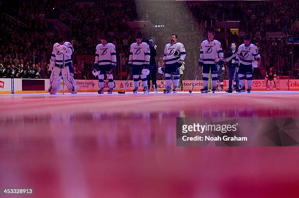 The Tampa Bay Lightning stand on the ice prior to the game against the Los Angeles Kings at Staples Center on November 19, 2013 in Los Angeles,...
