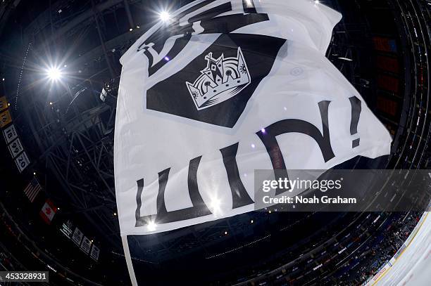 Flag is waved after the Los Angeles Kings defeated the Tampa Bay Lightning at Staples Center on November 19, 2013 in Los Angeles, California.