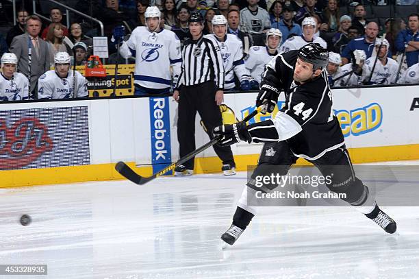 Robyn Regehr of the Los Angeles Kings shoots the puck against the Tampa Bay Lightning at Staples Center on November 19, 2013 in Los Angeles,...