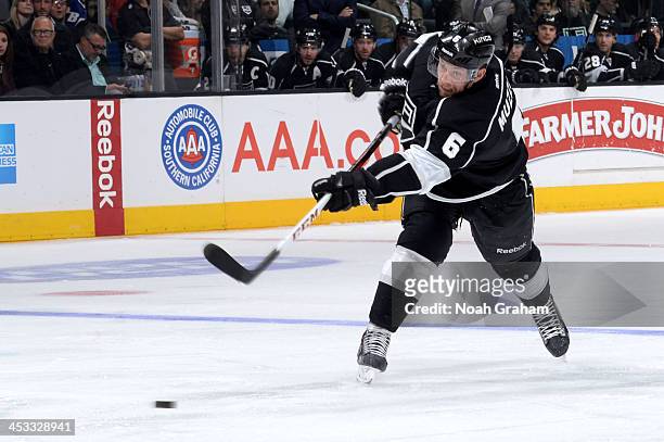 Jake Muzzin of the Los Angeles Kings shoots the puck against the Tampa Bay Lightning at Staples Center on November 19, 2013 in Los Angeles,...