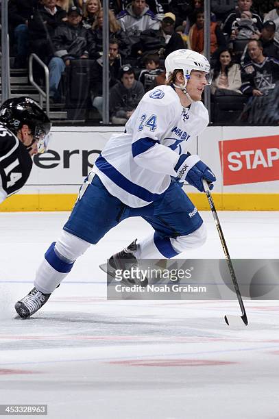 Dmitry Korobov of the Tampa Bay Lightning looks for the puck against the Los Angeles Kings at Staples Center on November 19, 2013 in Los Angeles,...