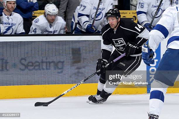 Justin Williams of the Los Angeles Kings skates with the puck against the Tampa Bay Lightning at Staples Center on November 19, 2013 in Los Angeles,...