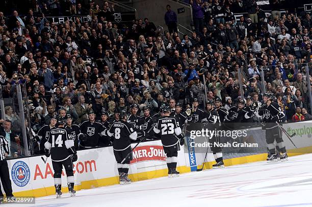 The Los Angeles Kings celebrate after a goal against the Tampa Bay Lightning at Staples Center on November 19, 2013 in Los Angeles, California.