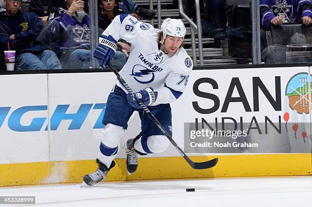 Pierre-Cedric Labrie of the Tampa Bay Lightning skates with the puck against the Los Angeles Kings at Staples Center on November 19, 2013 in Los...