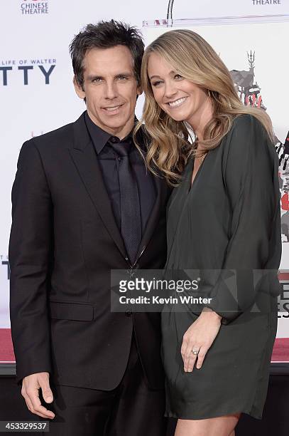 Actor Ben Stiller poses with his wife, actress Christine Taylor, as he is honored with a hand and footprint ceremony at TCL Chinese Theatre on...