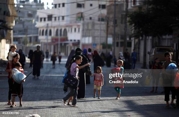 Palestinians flee homes as Israel resumes airstrikes on Gaza with the expiry of three-day ceasefire on August 08, 2014 in Gaza Strip. Israeli army...