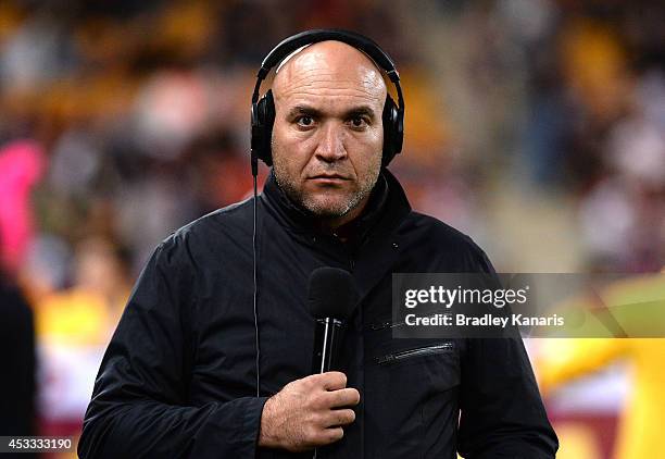 Former Broncos players Gordon Tallis is seen working as a commentator for radio station Triple M before the round 22 NRL match between the Brisbane...