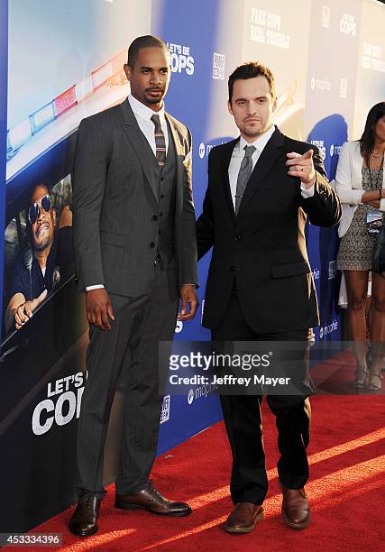 Actors Damon Wayans, Jr. And Jake Johnson attend the 'Let's Be Cops' Los Angeles Premiere held at the ArcLight Hollywood on August 7, 2014 in...