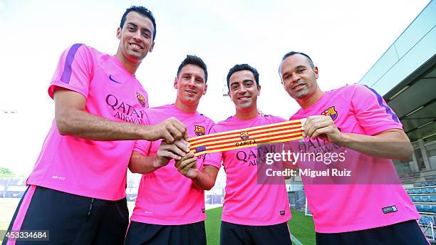 Sergio Busquets, Lionel Messi,Barcelona Vice Captains with Barcelona Captain Xavi and Andres Iniesta,Barcelona Vice Captain during training at the...