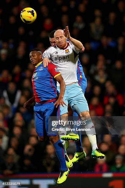 James Collins of West Ham wins a header under pressure from Kagisho Dikgacoi of Crystal Palace during the Barclays Premier League match between...