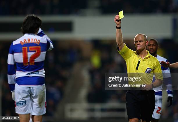 Joey Barton of QPR receives a yellow card from referee Andy Woolmer during the Sky Bet Championship match between Queens Park Rangers and Bournemouth...