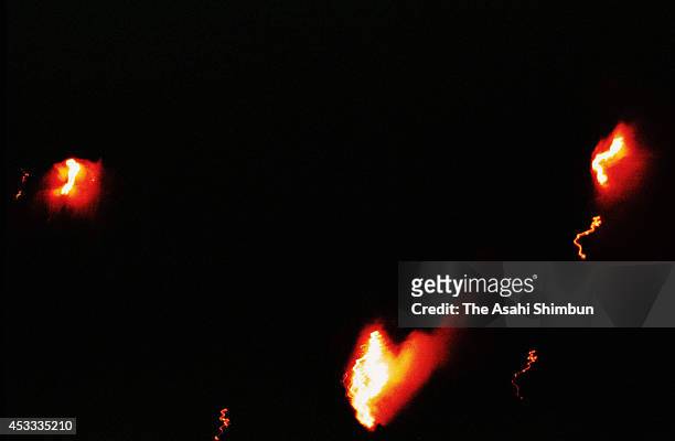 In this aerial image, fire of the crashed JAL 123 airplane are seen at the ridge of Mount Osutaka on August 12, 1985 in Ueno, Gunma, Japan. Japan...