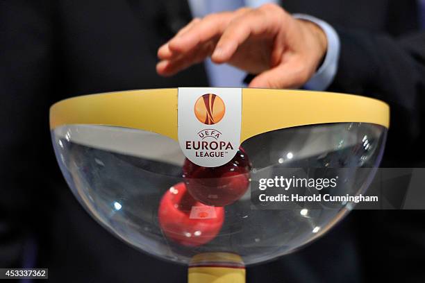 Draw balls are shuffled during the 2014/15 UEFA Europa League Play-off round draw at the UEFA headquarters, The House of European Football, on August...