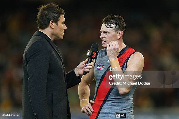 Brendon Goddard of the Bombers is interviewd by Matthew Richardson of Channel Seven at half time during the round 20 AFL match between the Richmond...