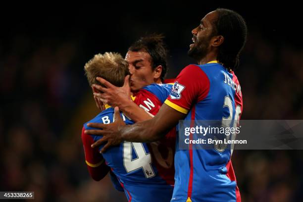 Marouane Chamakh of Crystal Palace celebrates with teammates Barry Bannan and Cameron Jerome after scoring the opening goal during the Barclays...