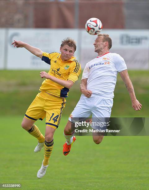 Volodymyr Gomenyuk and Toni Leistner go up for a header during the test match between 1. FC Union Berlin and Metalist Kharkiv on july 8, 2014 in Bad...