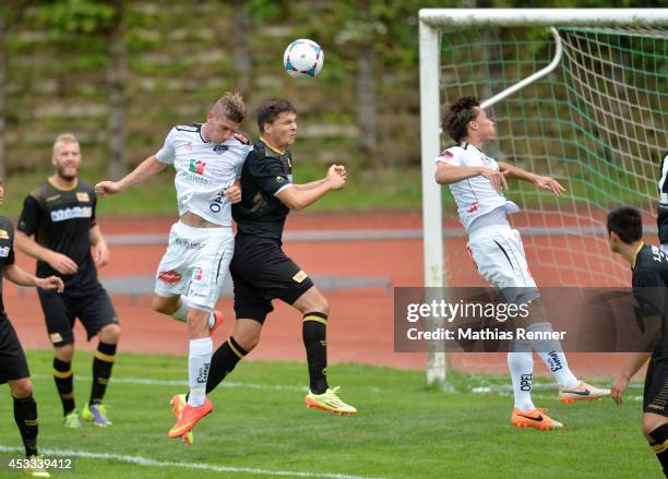 Tadej Trdina and Fabian Schönheim go up for a header during the test match between 1 FC Union Berlin and Wolfsberger AC on july 5, 2014 in...
