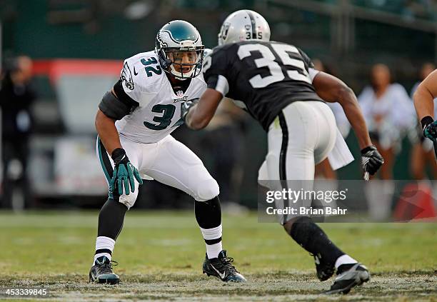 Running back Chris Polk of the Philadelphia Eagles blocks Chimdi Chekwa of the Oakland Raiders on a punt in the third quarter on November 3, 2013 at...