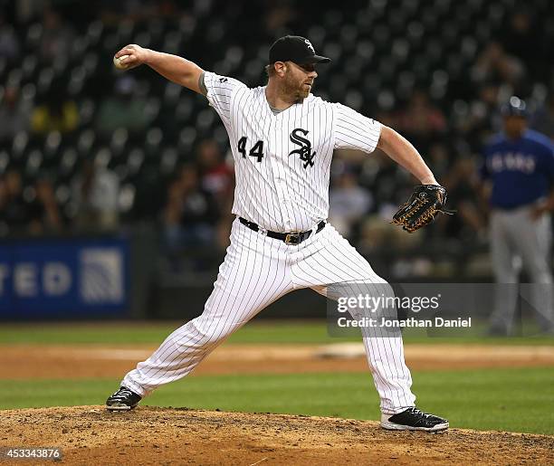 Adam Dunn of the Chicago White Sox pitches in the 9th inning against the Texas Rangers at U.S. Cellular Field on August 5, 2014 in Chicago, Illinois....