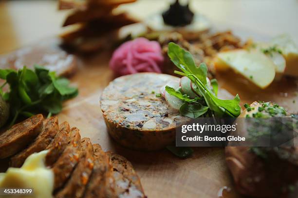 Charcuterie board featuring lamb rillettes at the Biltmore Bar & Grille in Newton. From above, with entire board visible, selection is as follows:...