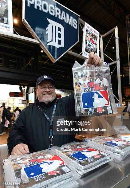 Vendor holds up a ALCS Program prior to Game Four of the American League Championship Series between the Detroit Tigers and the Boston Red Sox at...