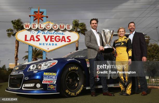 Sprint Cup Champion Jimmie Johnson, driver of the Lowe's Chevrolet, Miss Sprint Cup Brooke Werner, and crew chief Chad Knaus pose for a photo at the...