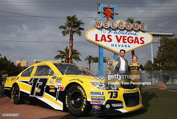 Sprint Cup Champion Jimmie Johnson, driver of the Lowe's Chevrolet and Miss Sprint Cup Brooke Werner pose for a photo at the 'Welcome to Fabulous Las...