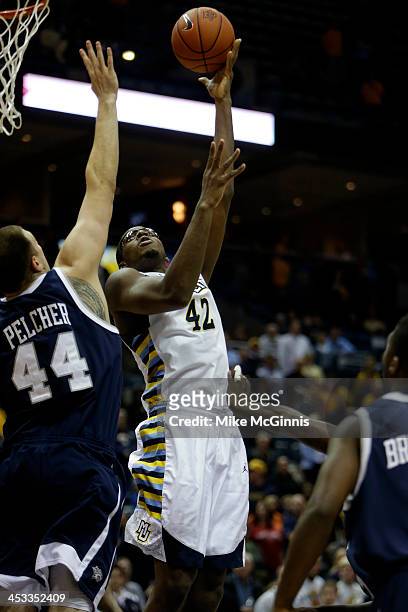 Chris Otule of the Marquette Golden Eagles pulls up with a jump hook during the game against the New Hampshire Wildcats at BMO Harris Bradley Center...