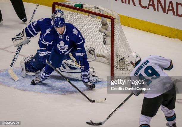 San Jose Sharks center Joe Thornton put the puck past Toronto Maple Leafs goalie James Reimer and Toronto defenseman Dion Phaneuf to make it 2-0 as...