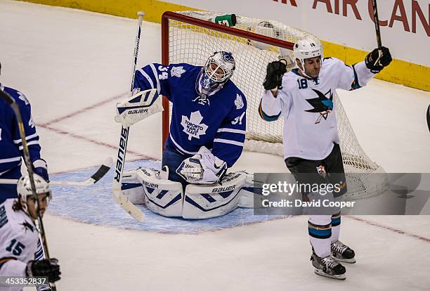 Toronto Maple Leafs goalie James Reimer reacts after giving up the first of two goals in the opening period as theToronto Maple Leafs take on the San...