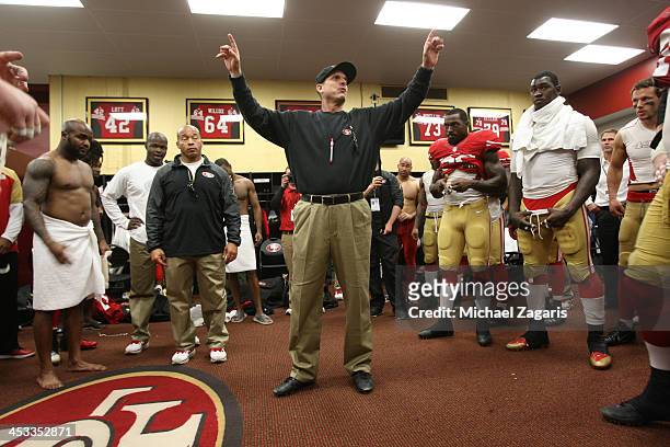 Head Coach Jim Harbaugh of the San Francisco 49ers addresses the team in the locker room following the game against the St. Louis Rams at Candlestick...