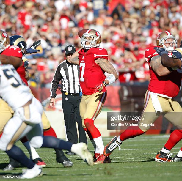 Colin Kaepernick of the San Francisco 49ers passes during the game against the St. Louis Rams at Candlestick Park on December 1, 2013 in San...