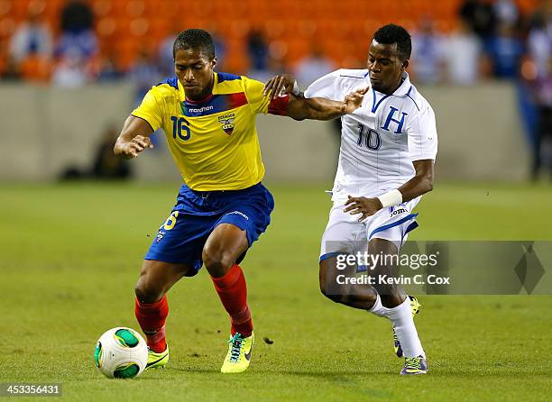 Antonio Valencia of Ecuador against Marvin Chavez of Honduras during an international friendly match at BBVA Compass Stadium on November 19, 2013 in...