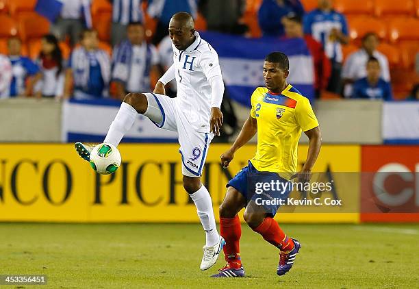 Jerry Palacios of Honduras against Jorge Guagua of Ecuador during an international friendly match at BBVA Compass Stadium on November 19, 2013 in...