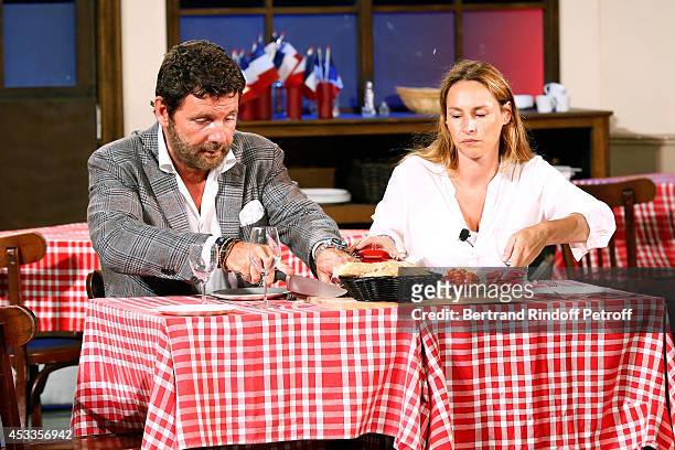 Actors Vanessa Demouy and Philippe Lellouche perform in the "L'appel de Londres" play at the 30th Ramatuelle Festival : Day 8 on August 8, 2014 in...