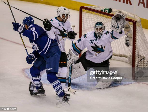 San Jose Sharks goalie Antti Niemi grabs the puck out of the air as the Leafs stepped up their attach during the 2nd period as theToronto Maple Leafs...