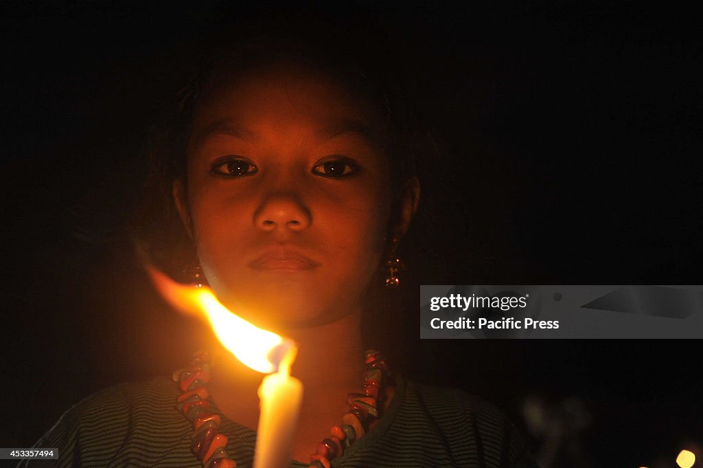 Indigenous people light candles at Central Shahid Minar in...